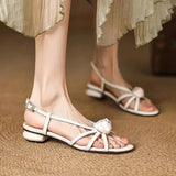 Bonnyshow  A word buckle with flower low heel sandals women 2025 summer new external wear open toe Roman women's shoes