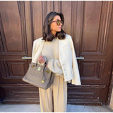 Bonnyshow  Elegant Covered Button Short Women's Jacket Solid V-neck Full Sleeve Pockets Coats Female 2025 Spring Autumn Lady Streetwears